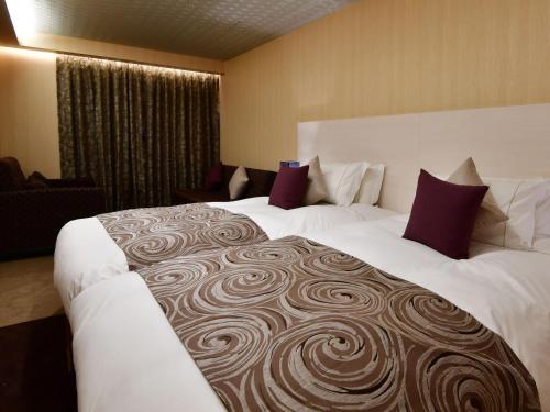 优选奈良站世纪酒店客房内的一张或多张床位
