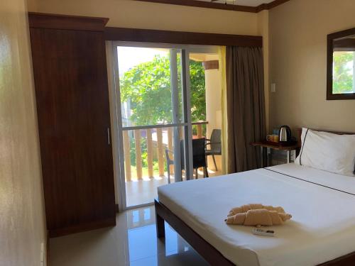 马拉帕斯加星光度假酒店客房内的一张或多张床位