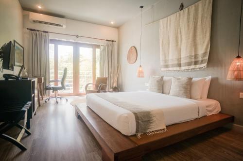 伊吕波花园酒店及度假村客房内的一张或多张床位