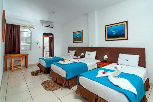 科罗玛加拉帕格斯酒店客房内的一张或多张床位