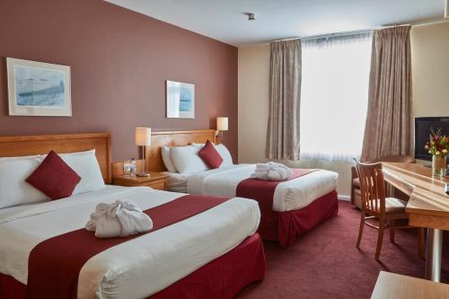 普利茅斯未来旅馆客房内的一张或多张床位