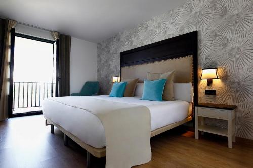 VISTALEGRE Hotel-Spa客房内的一张或多张床位