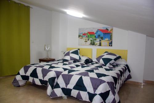 马尔瓦罗萨海滩假日公寓酒店客房内的一张或多张床位