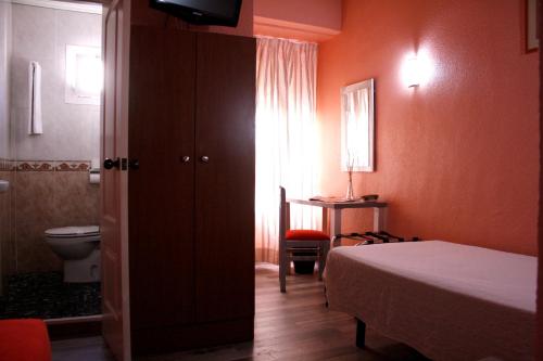 Hotel Universal Murcia客房内的一张或多张床位
