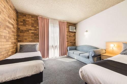 达博​​市康福特茵酒店客房内的一张或多张床位