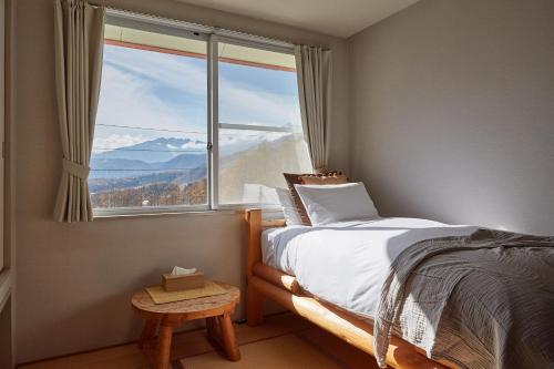 Canopy Lodge - Boutique Lodge at Hakuba Cortina客房内的一张或多张床位