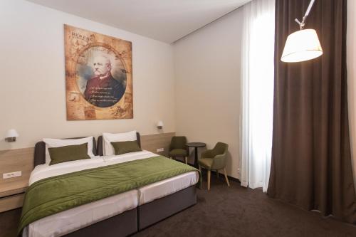 Hotel Grand Hedonist客房内的一张或多张床位