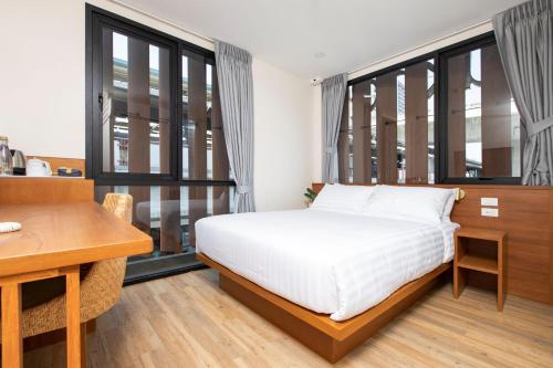 Sukhon Hotel - SHA Plus客房内的一张或多张床位
