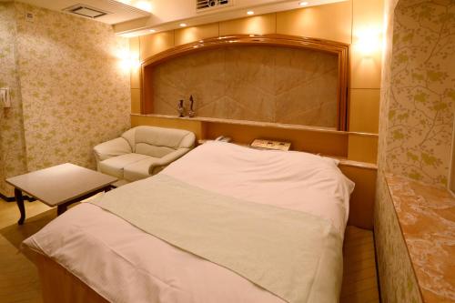 Hotel Fine Garden Kosei (Adult Only)客房内的一张或多张床位