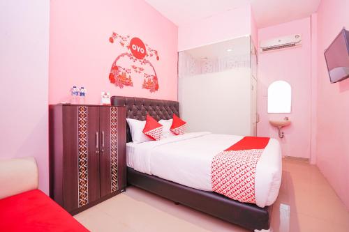 OYO 223 Penginapan Nabila Syariah客房内的一张或多张床位