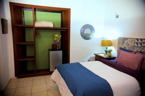 旧圣胡安福塔雷萨套房酒店客房内的一张或多张床位