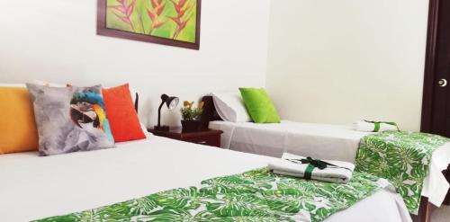 Hotel Tropical客房内的一张或多张床位