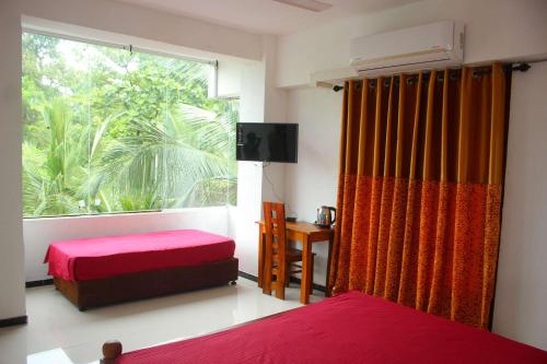 Heritage Eco Resort Kelaniya客房内的一张或多张床位