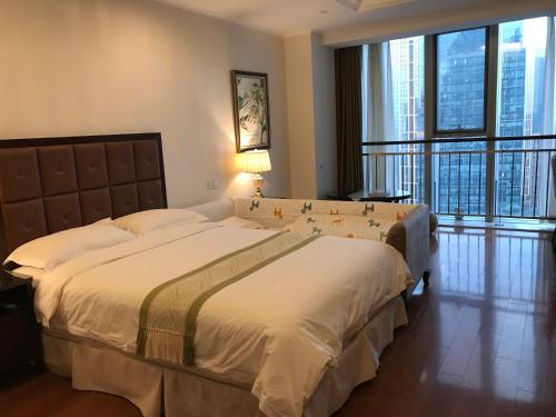 青岛易达屋酒店公寓客房内的一张或多张床位