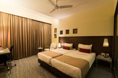 Sentosa Resorts & Water Park客房内的一张或多张床位