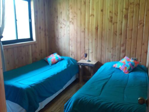 Arquería Patagonia Lodge客房内的一张或多张床位