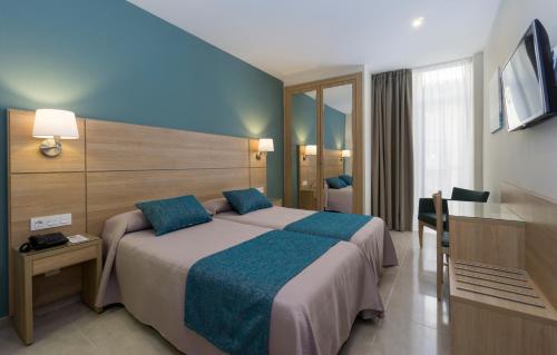 苏马拉加酒店客房内的一张或多张床位