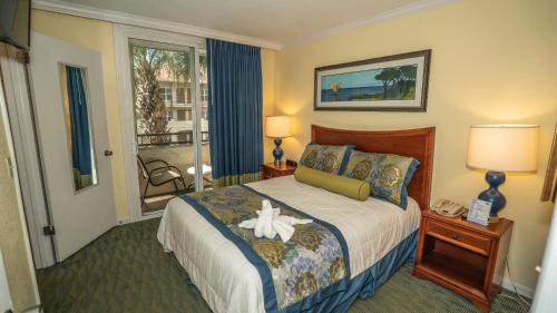 布纳维斯塔湖蓝树度假酒店客房内的一张或多张床位