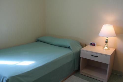 荷兰学院格伦德宁大厅公寓式酒店客房内的一张或多张床位