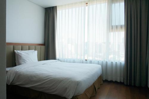 瓦比恩套房1号服务式酒店客房内的一张或多张床位