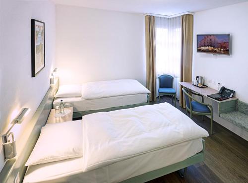 萨梅劳提契诺瑞士品质酒店客房内的一张或多张床位