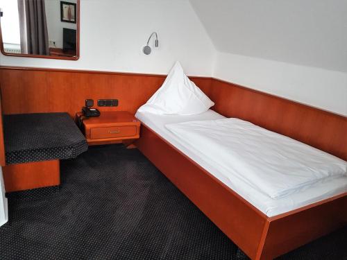 瓦尔茨酒店客房内的一张或多张床位
