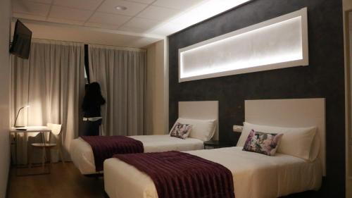 Hotel Malecon客房内的一张或多张床位