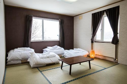 Absolute Niseko Lodge客房内的一张或多张床位