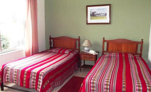 嘉米娜旅舍客房内的一张或多张床位