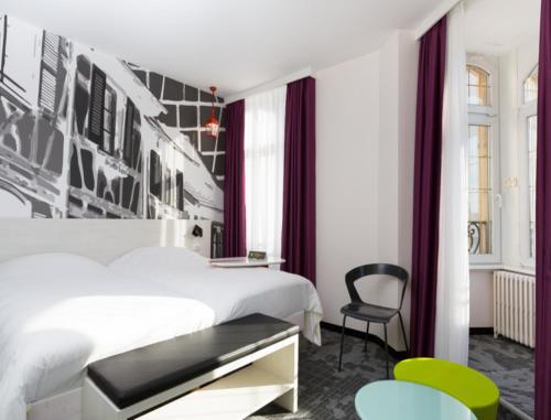 斯特拉斯堡小法国宜必思尚品酒店客房内的一张或多张床位