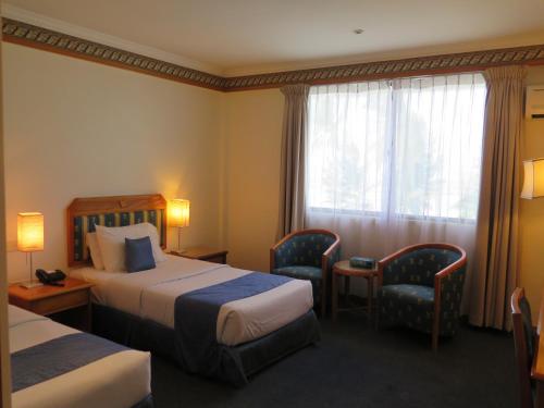 Sea View Resort Hotel & Apartments客房内的一张或多张床位