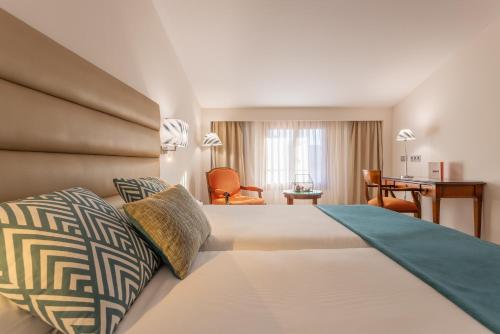 依赞特鲁希略酒店客房内的一张或多张床位