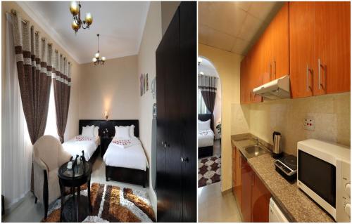 阿吉曼Al Smou Hotel Apartments - MAHA HOSPITALITY GROUP的酒店客房带两张床和厨房
