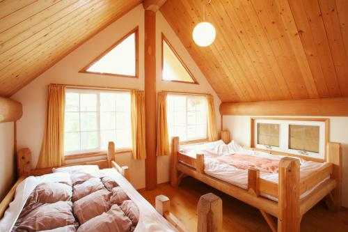 Kurokawa Mori no Cottage客房内的一张或多张床位