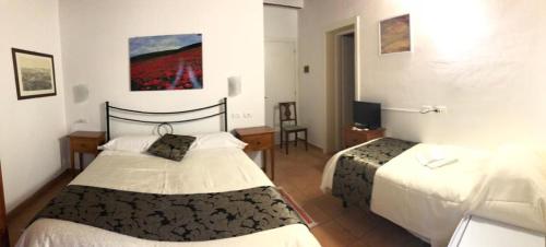 锡耶纳托斯卡纳旅馆客房内的一张或多张床位