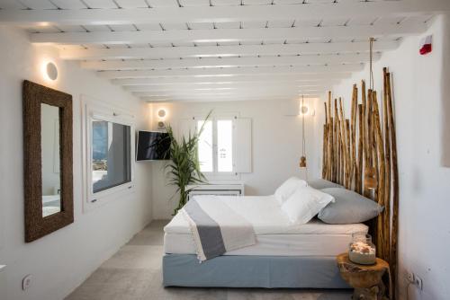 9 Islands Suites Mykonos客房内的一张或多张床位