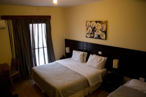 Hotel Brisa Rio客房内的一张或多张床位