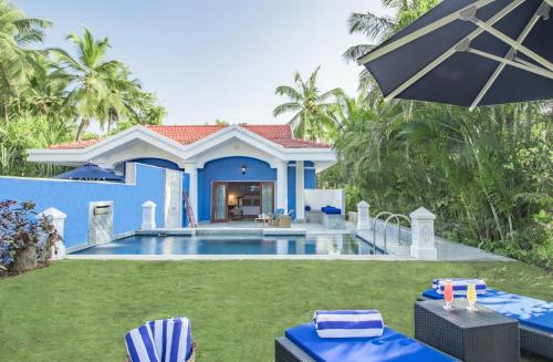 比纳里姆果阿泰姬陵酒店&度假村的一座带游泳池和房子的别墅