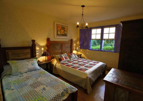 A Casa Vermelha Hospedaria客房内的一张或多张床位