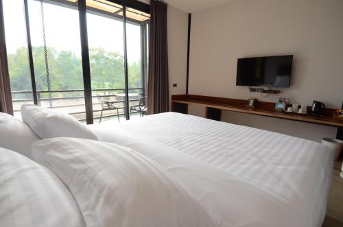Baan Wanwaree客房内的一张或多张床位