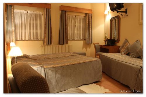 巴尔塔扎尔酒店客房内的一张或多张床位