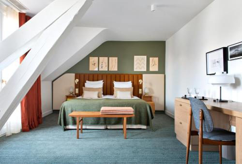 度佩勒比塞 - 简苏派斯酒店客房内的一张或多张床位