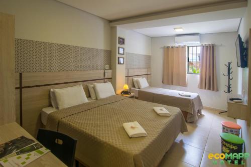 EcoMAPP Hotel客房内的一张或多张床位