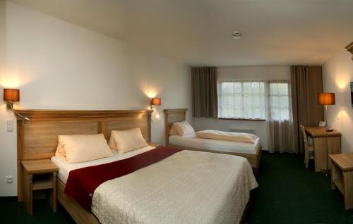 斯坦恩度假酒店客房内的一张或多张床位