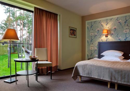 Margis Hotel & SPA客房内的一张或多张床位