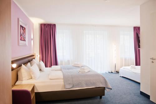 尼古拉公寓酒店客房内的一张或多张床位