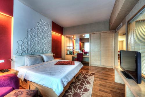 Raia Hotel Kota Kinabalu客房内的一张或多张床位