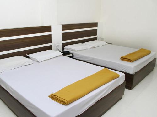 Mp Residency客房内的一张或多张床位