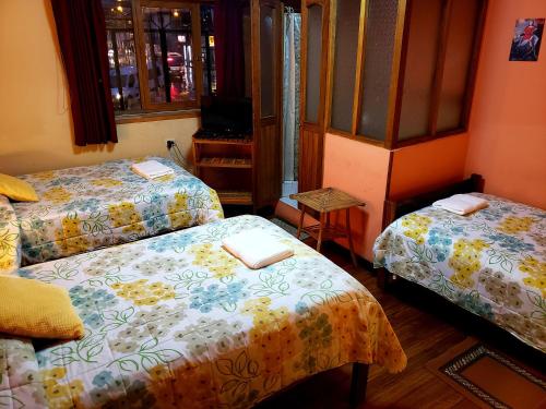 Hostal La Nuit客房内的一张或多张床位