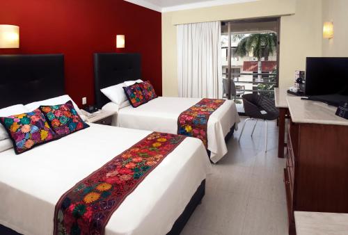阿德哈拉哈齐恩达坎昆酒店客房内的一张或多张床位